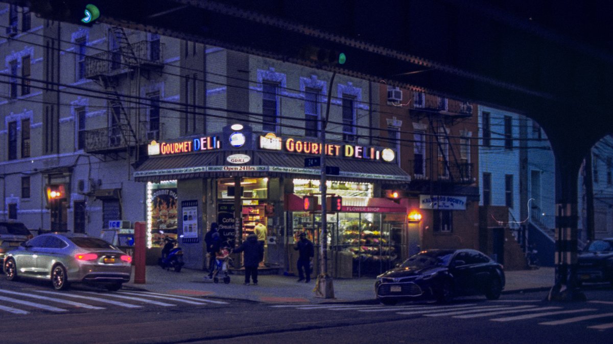 Gourmet Deli at night, under the tracks