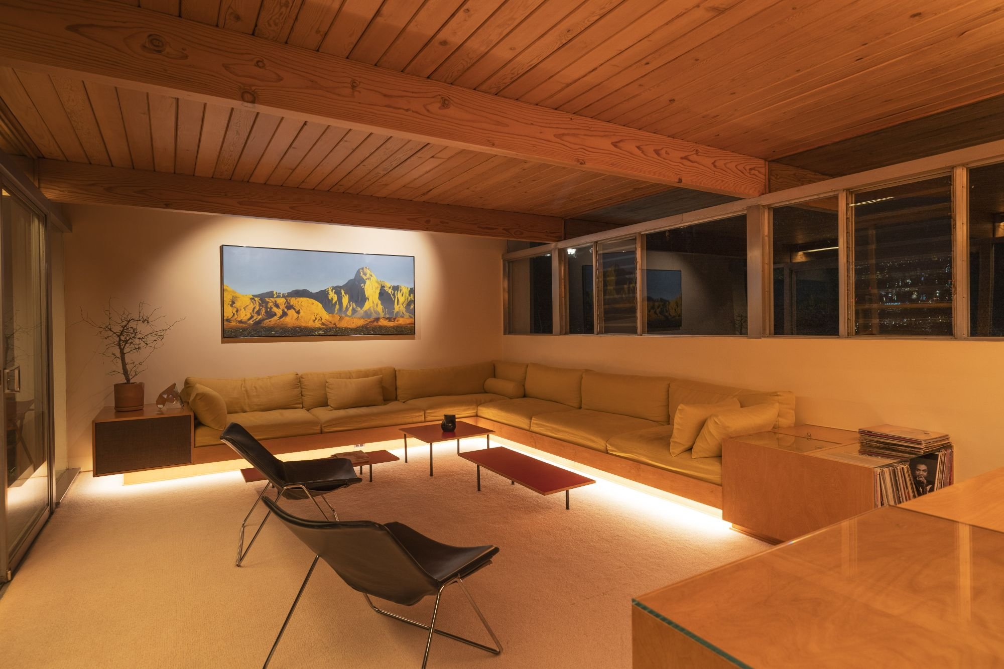 Mid-century sunken lounge at dusk