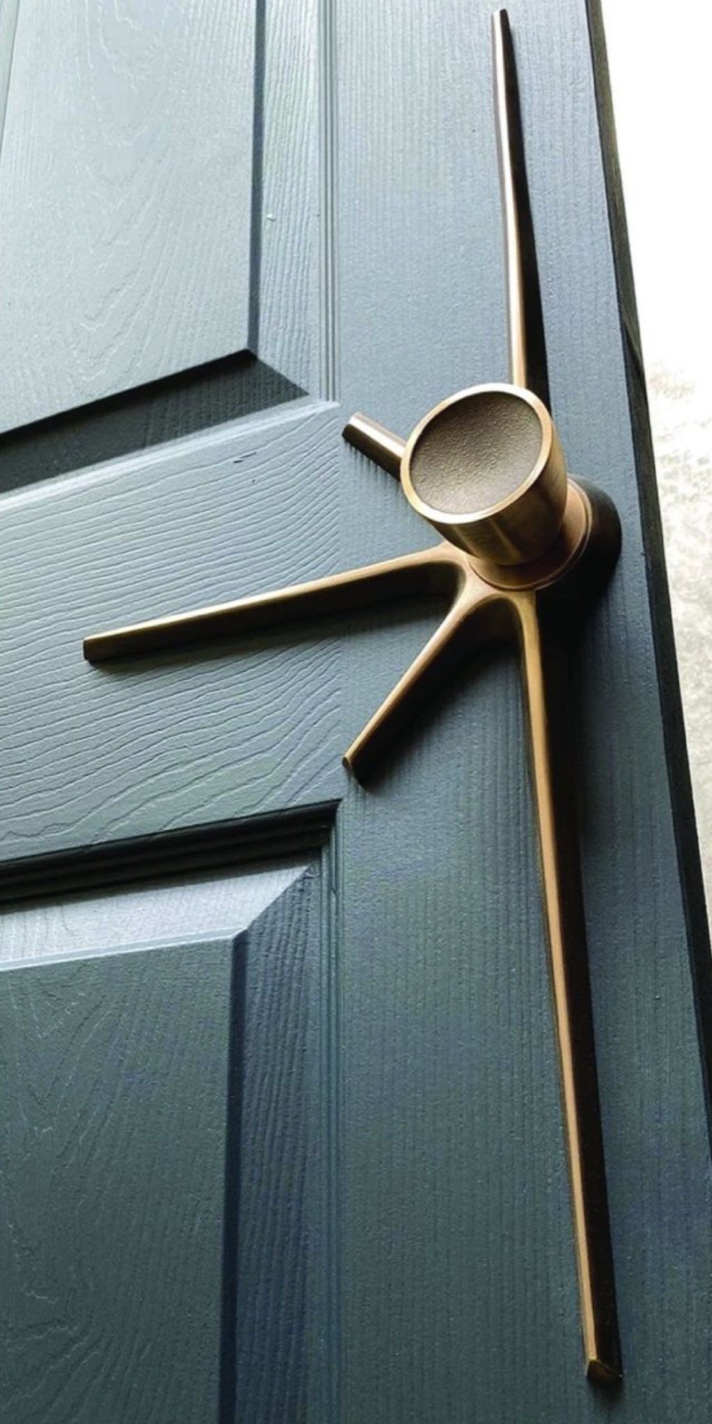 Sculptural bronze door handle