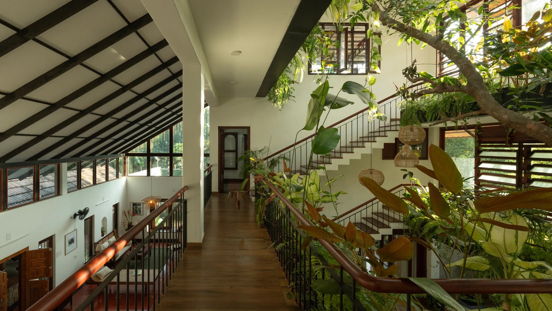 Tropical mezzanine walkway with cascading greenery
