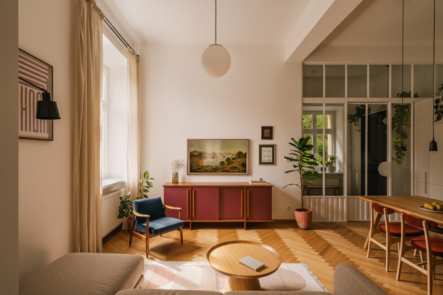 Herringbone apartment with burgundy sideboard