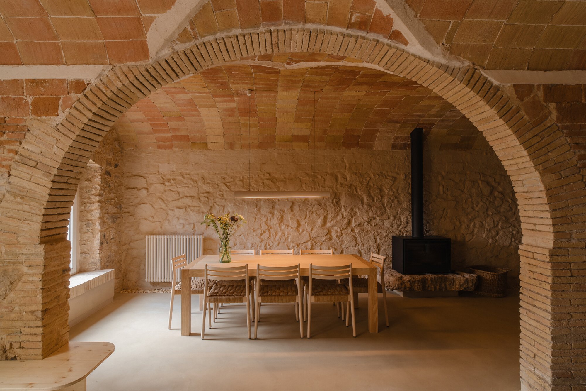 Vaulted brick farmhouse dining room