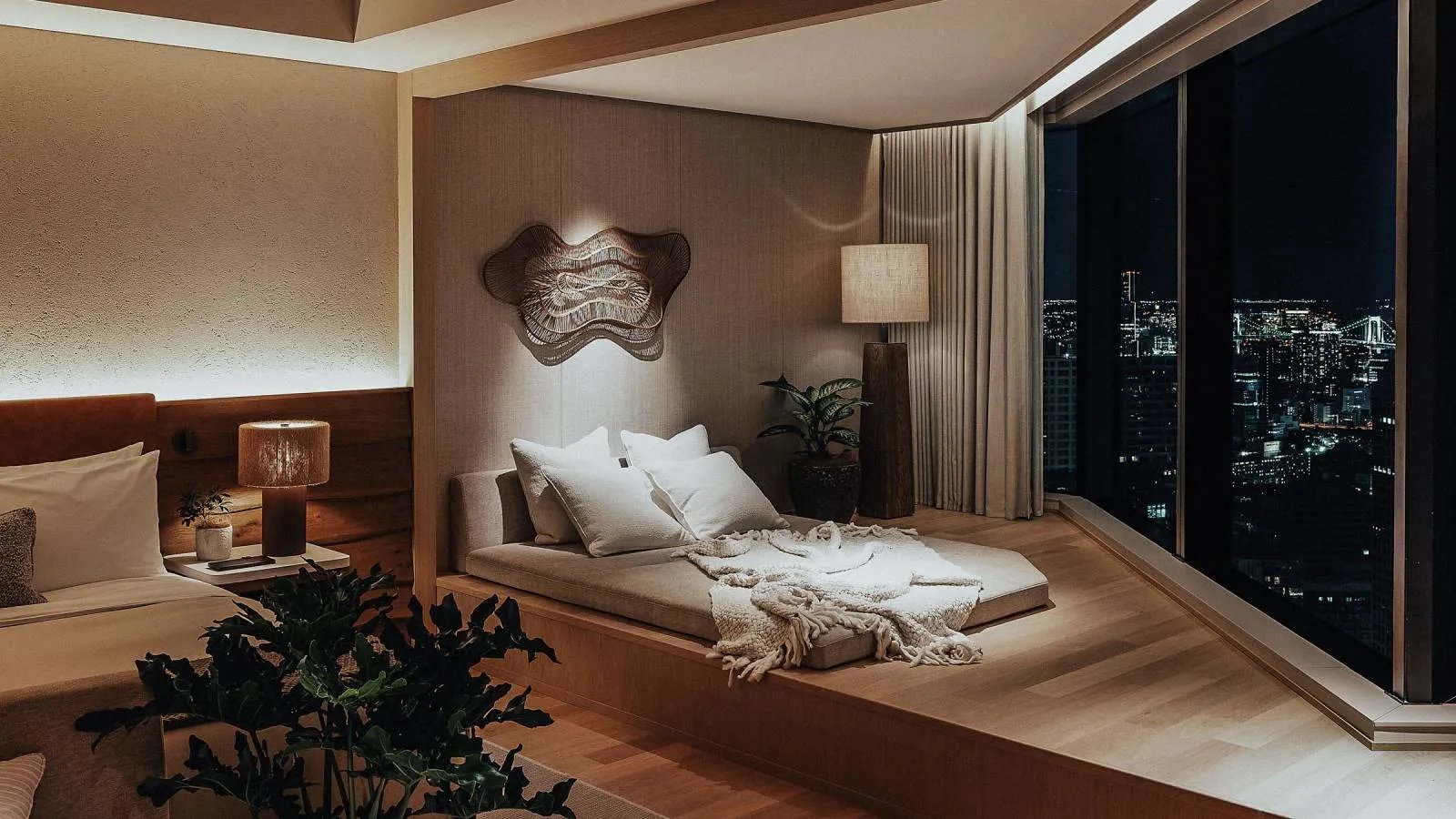 Japandi hotel bedroom over city lights