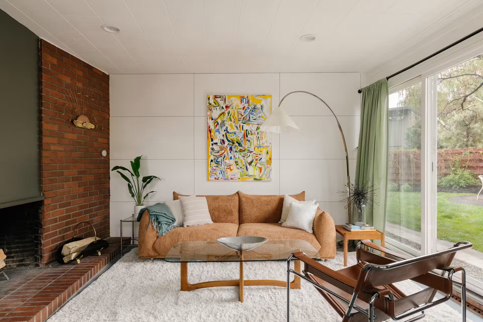 Mid-century living room with brick fireplace