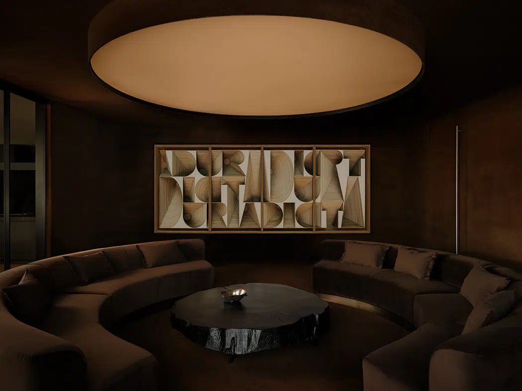 Dim lounge with circular sofa and type relief