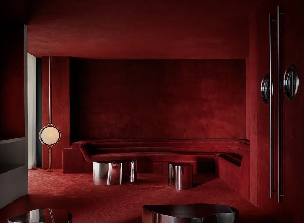 All-red velvet lounge with chrome tables