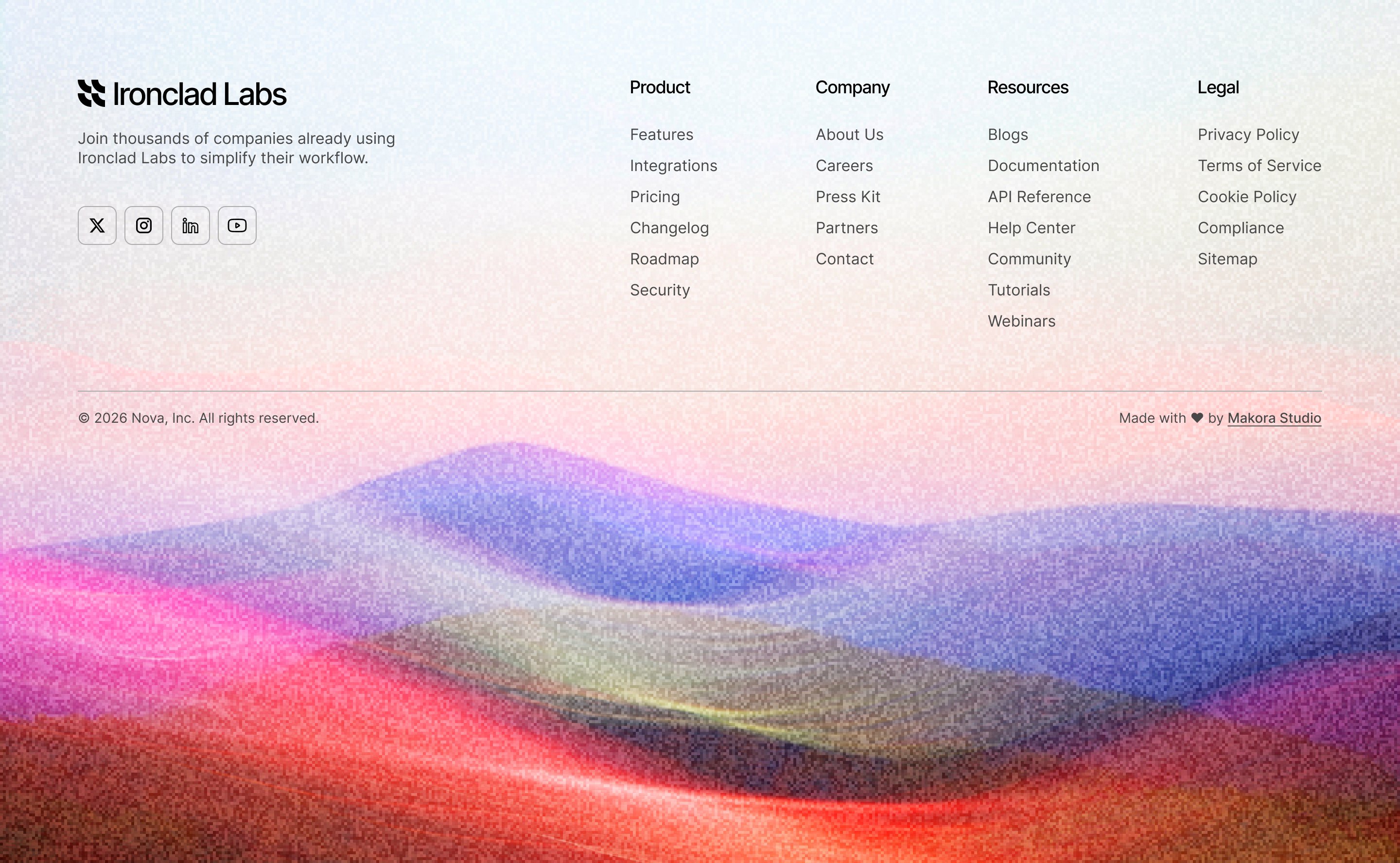 Ironclad Labs site footer with gradient dunes