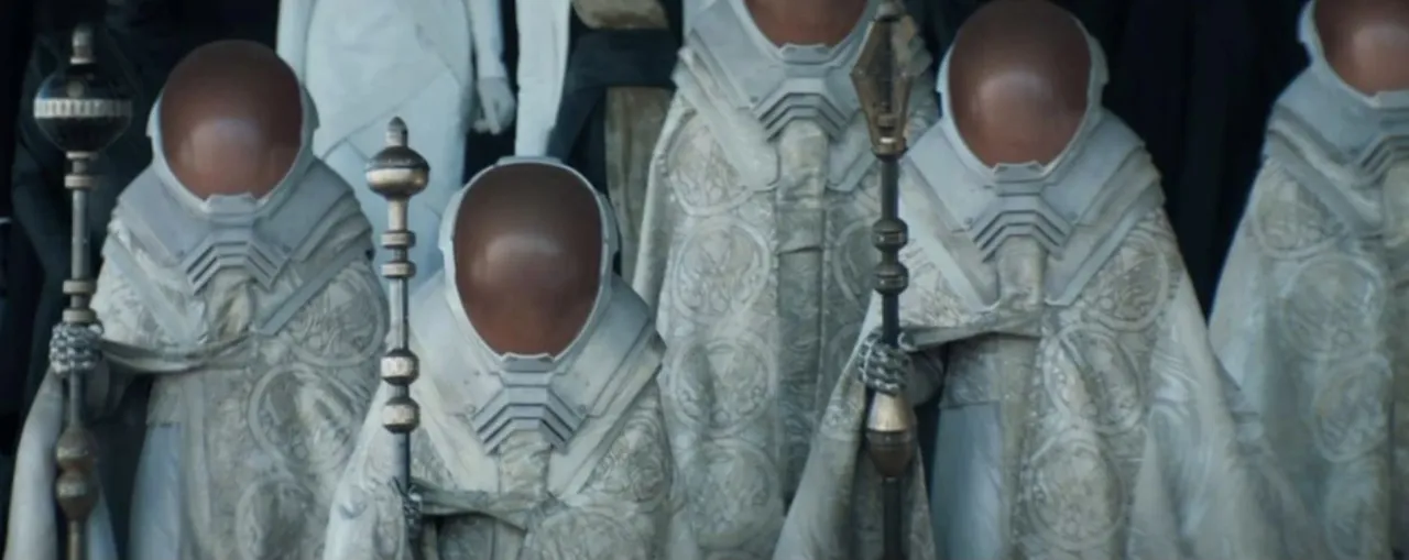 Faceless robed heralds with staffs, film still