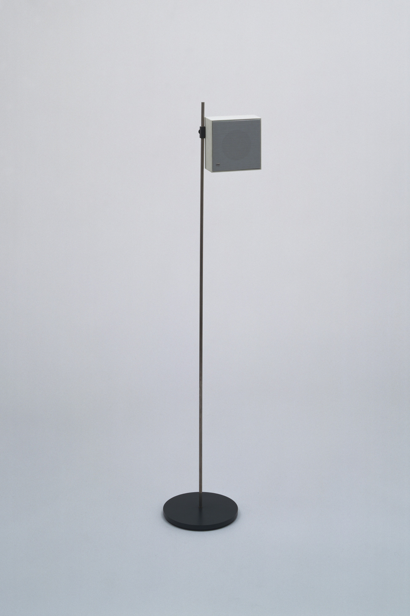 Braun cube speaker on slender floor stand